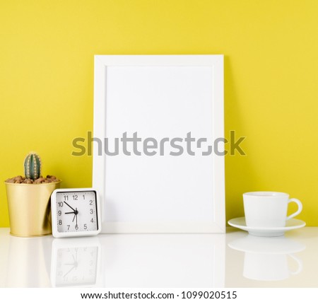 Blank white frame, clock, succulent,mug with tea or coffee again