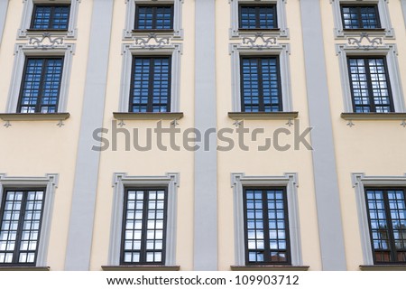 Dark blue sky is reflected in building windows