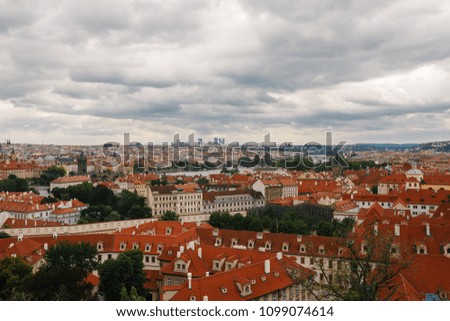 Czech Republic, Prague, July 25, 2017: Panoramic view of the city. Red Roofs of houses and structures of the old city in the summer in cloudy cloudy weather.