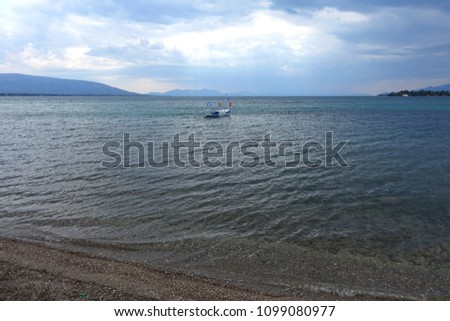 Photo from famous seascape in fishing village of Eretria in cloudy weather, Central Evia, Greece