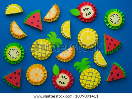 Fruit made of paper. blue background. There's room for writing.Tropics. Flat lay.