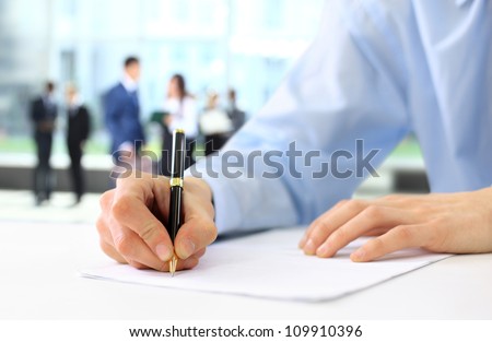 Businessman is signing a contract