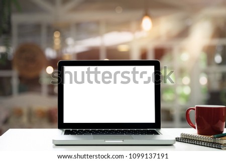 Empty space,desk white with on Laptop computer with blank screen and coffee cup ,at cafe blurred background of light bokeh.
