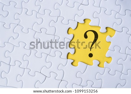 question mark on jigsaw puzzle with yellow background. question, faq and q&a concept Royalty-Free Stock Photo #1099153256