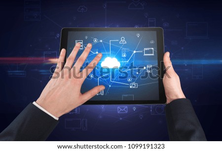 First person view of a hand using tablet with cloud office concept