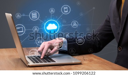 Businessman hand typing with cloud technology system and office symbol concept Royalty-Free Stock Photo #1099206122