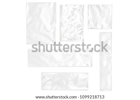 Few cellophane bags for candy. White bags package template in different size  on isolated background. Royalty-Free Stock Photo #1099218713