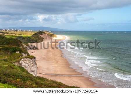 Aerial view of family walking on Whiterocks Beach Portrush in summer,county Antrim, Northern Ireland