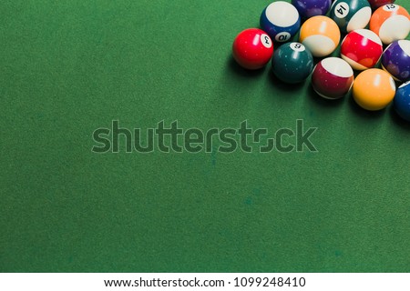Top view of pool billiards snooker balls on green table with setup position ready for break. Royalty-Free Stock Photo #1099248410