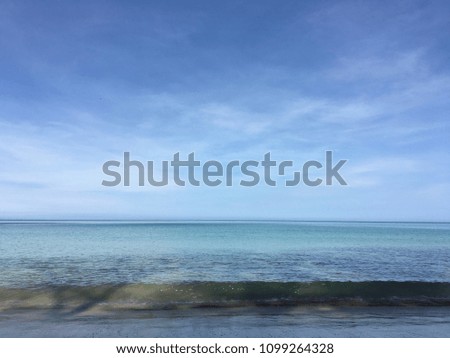 Bangsak_Beach in morning , south of Thailand. Sea sky,In the summer.Beautiful white clouds on blue sky over calm sea with sunlight
