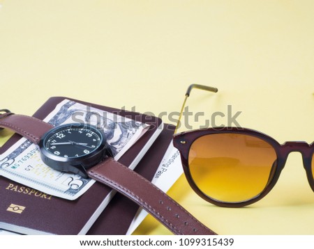 Concept go travel holiday, Vacations plan Boarding pass and passport, bank note, watch, sunglass and plan  go tourist on yellow background