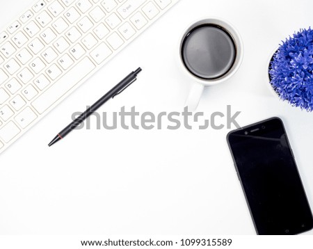 Modern white office desk table with keyboard computer, coffee, smart phone and other office supplies of necessity, Top view with copy space