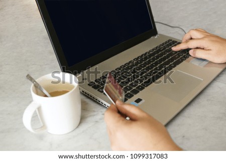 laptop, credit card, glasses, a cup of coffee on white table background, for shopping online concept.