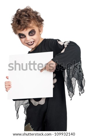 Portrait of little boy wearing halloween costume with empty white board on white background