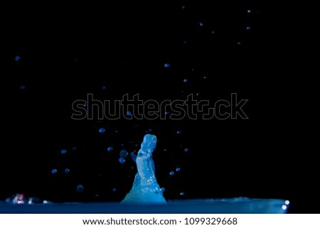 Blue water drop with black background