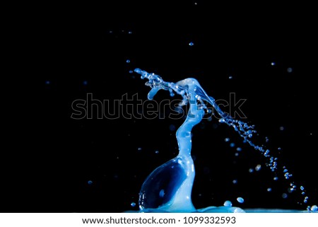 Blue water drop with black background