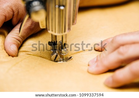 Closeup view at the upholstery sewing machine Royalty-Free Stock Photo #1099337594