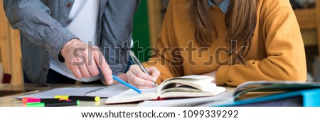 Young teacher helping his student in chemistry class. Education, Tutoring and Encouragement concept. Web banner. Royalty-Free Stock Photo #1099339292