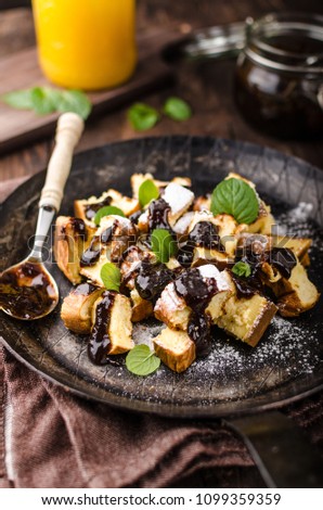 Cutted pancakes, Kaiserschmarrn delish dessert with plums, food photography, food stock