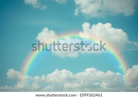 Cloudscape rainbow of natural sky with blue sky and white clouds and colorful rainbow in the sky use for wallpaper background, Process in vintage style