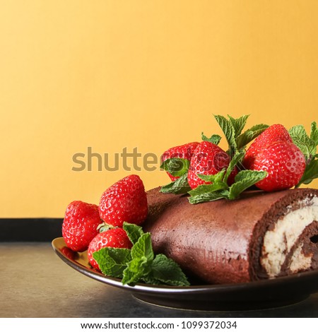 Delicious homemade chocolate cake with strawberries and mint. Dark background. Celebratory dinner
