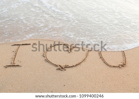 Message i love you on the sand beach background