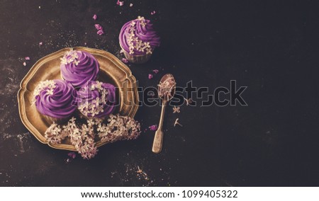 lilac cupcakes on a dark background