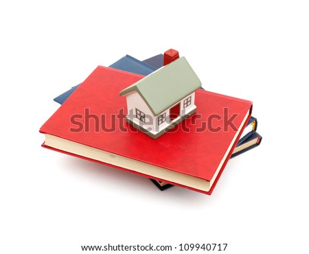 little house and books isolated on white background