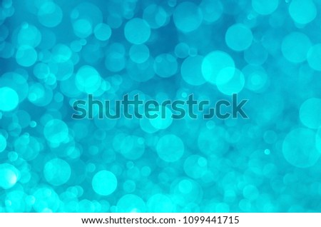 abstract aqua blue bokeh glitter sparkle background.