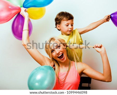 pretty real family with color balloons on white background, blon