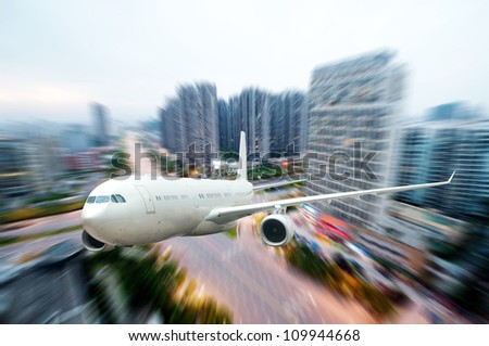 the airplane away from the city,abstract background