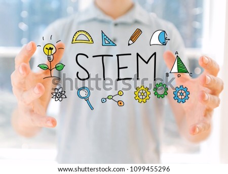 STEM with young man holding his hands Royalty-Free Stock Photo #1099455296