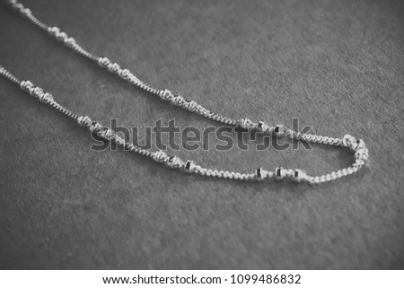 Silver bracelet on a blue background