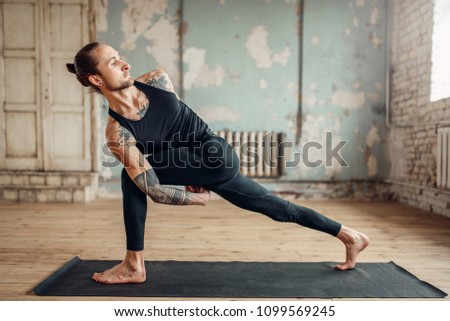 Male yoga doing flexibility exercise