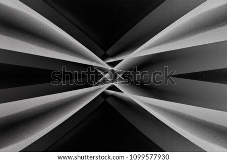Close-up photo of modern building with optical effect of refracting prism in center of composition. Abstract architecture with sloped girders and. Black and white chiaroscuro background.