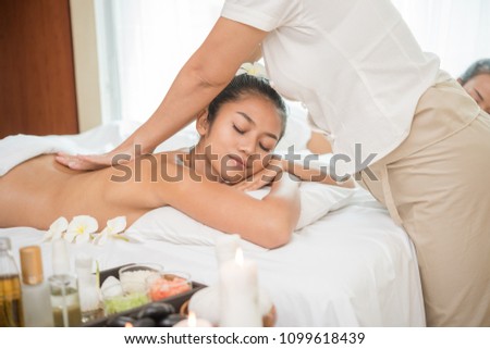 Massage. Beautiful girl in spa salon