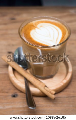 Cup of piccolo latte coffee with latte art, stock photo