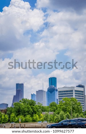 A View of a city's skyline from a park.