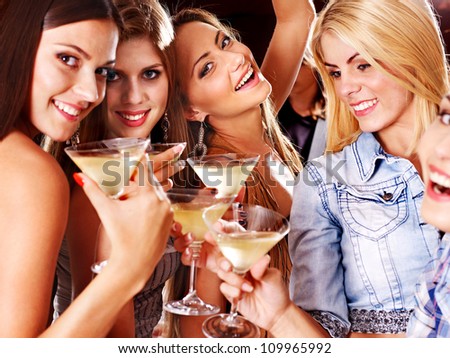 Woman on disco in night club. Lighting effects. Royalty-Free Stock Photo #109965992