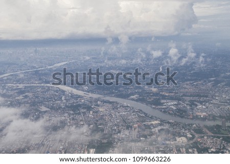 Aerial photography Clouds and sky as seen through window of an aircraft.