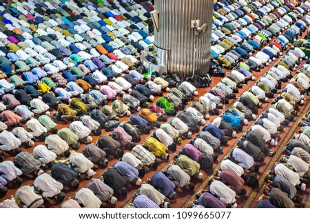 Muslim are Praying in Istiqlal Mosque, The Biggest Mosque in South East Asia, Jakarta, Indonesia Royalty-Free Stock Photo #1099665077