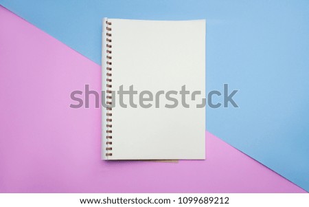 Blank paper notebook or notepad on pastel background.Top view , flat lay