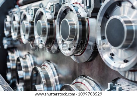 Large, massive steel rollers machines for wire drawing. Abstract industrial background. Royalty-Free Stock Photo #1099708529