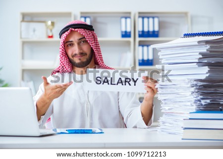 Arab man sitting at desk with message