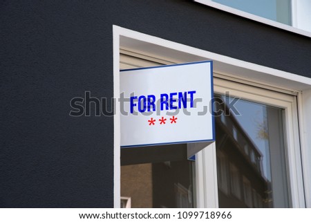 An Apartment And A Sign For Rent