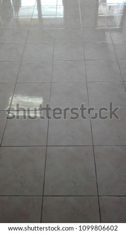 Reflections on floor tiles.