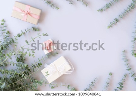 Gift boxes with green leaves