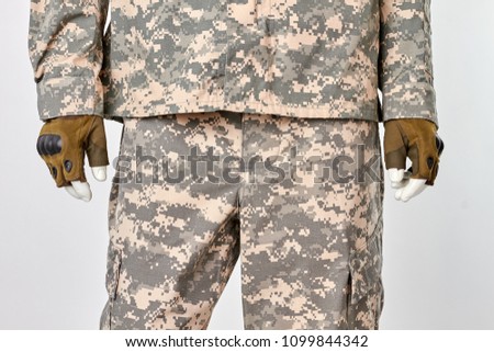 Military soldier outfit with fingerless gloves. Front view. White isolated background.