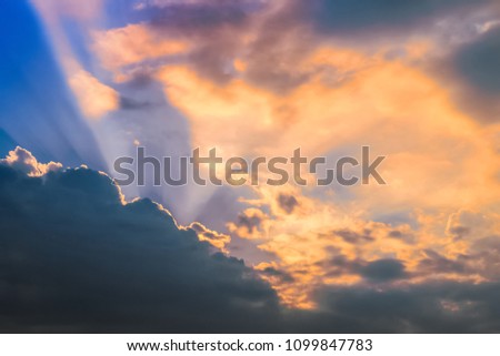 dramatic sky in the clouds. the real rays of the sun make their way. concept inspiration. background