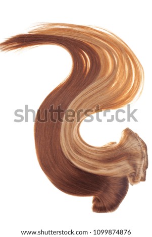 Picture of remy woman's hair extensions in different colors isolated on white